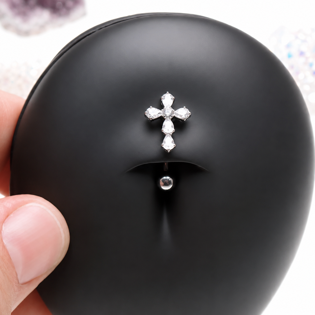 Titanium cross floating belly ring in 14g with a sleek cross design, ideal for body piercing and stylish body jewelry.