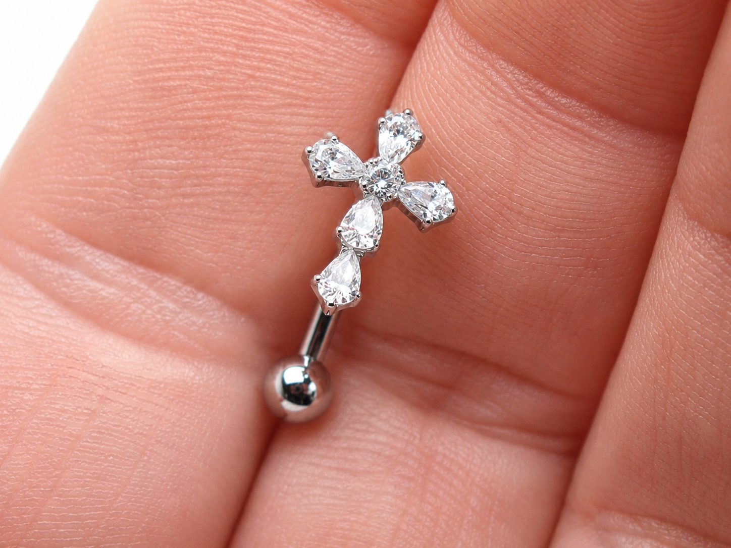 Titanium cross floating belly ring in 14g from Body Clickers, featuring a sleek, minimalist design with a floating cross charm.