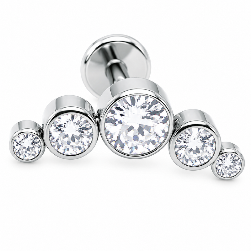 Silver stud earring with clear gemstones on a white background helix piercing 