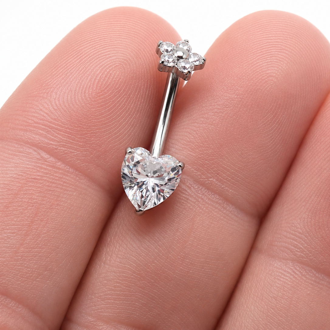 Titanium heart and flower CZ belly ring in 14g body jewelry with a 10mm design, featuring a sparkling decorative charm.
