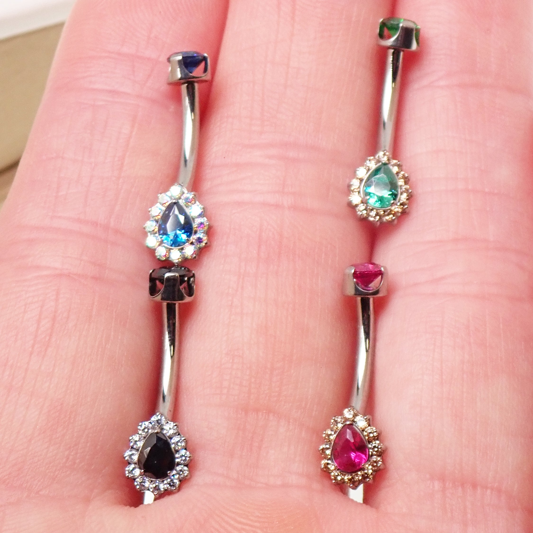 Titanium internally threaded 14g belly ring in multiple colors, body jewelry featuring a sleek and secure design.