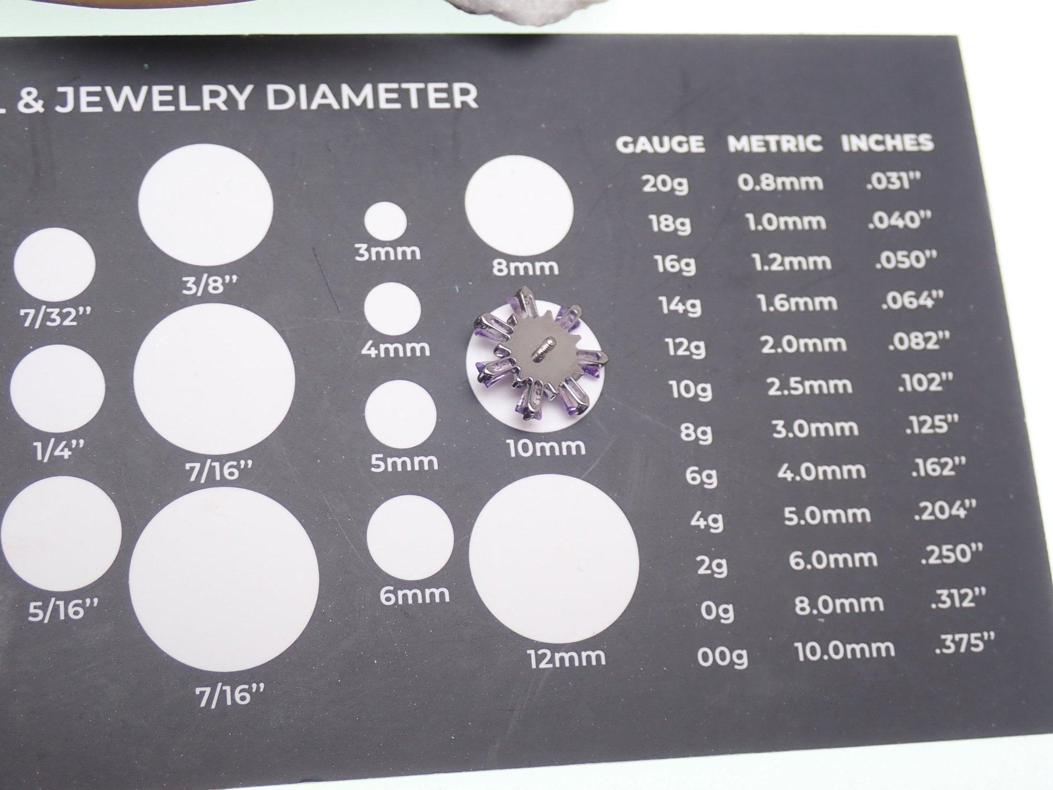 Amethyst and cubic zirconia cluster titanium flatback piercing with silver-tone finish, featuring sparkling gemstones and sleek design.