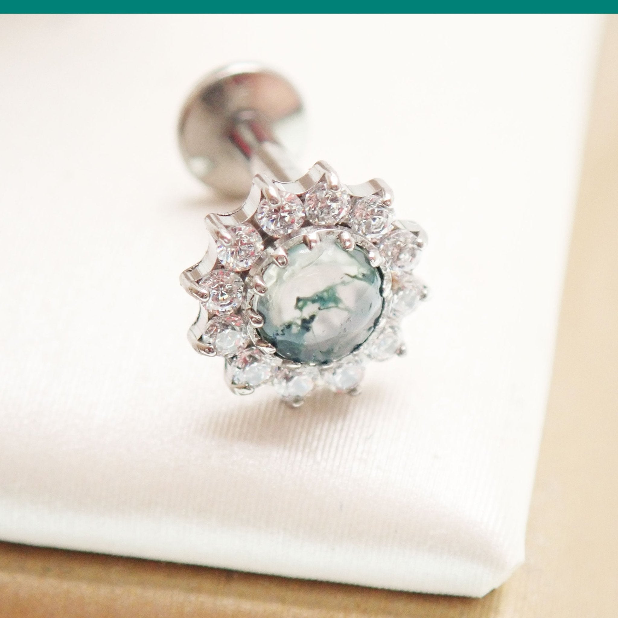 18g Moss Agate natural stone and CZ flatback body jewelry by Body Clickers, featuring a polished, earthy gemstone design.