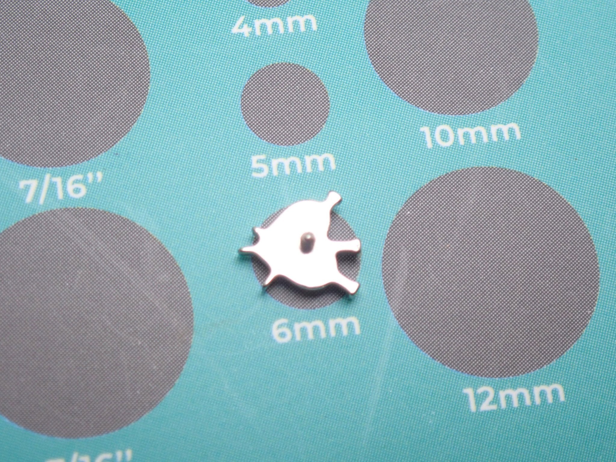 Titanium flatback nailed heart implant piercing by Body Clickers, 18g 6mm internally threaded for body jewelry.