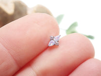 18G rose quartz cluster titanium flatback piercing by Body Clickers, featuring a sparkling pink gemstone and sleek metal design.