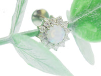White fire opal and CZ flatback body jewelry by Body Clickers, featuring 6mm stones on a sleek, comfortable 18g design.