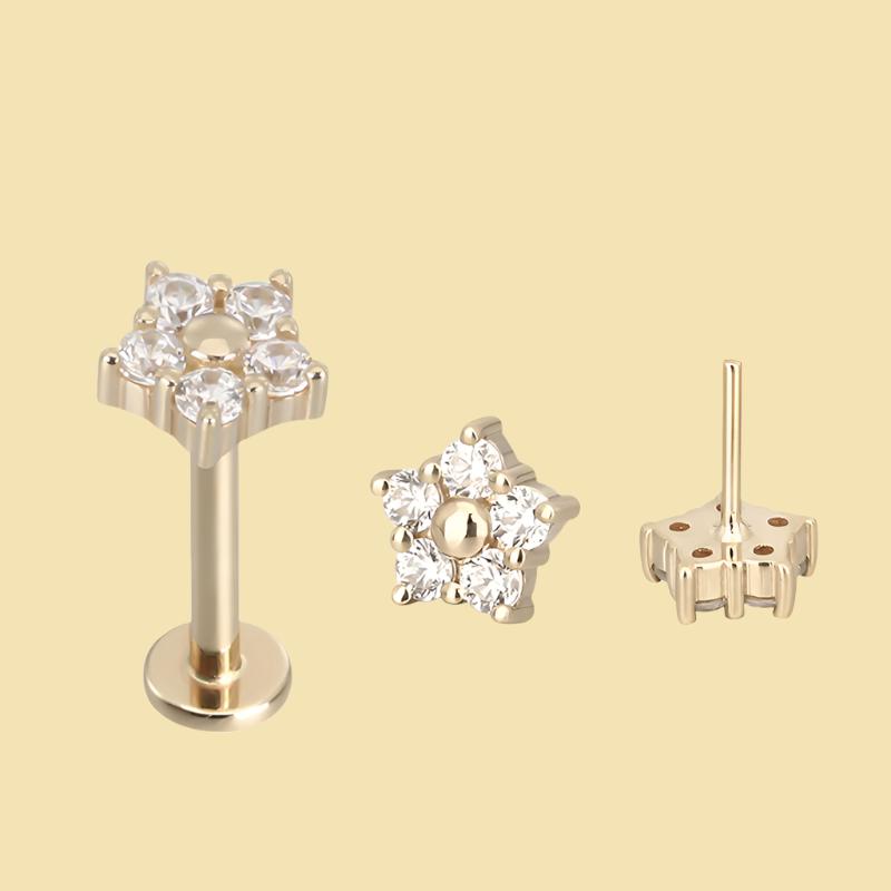 14k gold flower titanium flatback push-fit piercing by Body Clickers, showcasing a delicate floral design on a secure threadless jewelry piece.