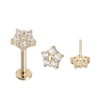 14k gold flower design titanium flatback push fit piercing by Body Clickers, showcasing the detailed floral jewelry in a close-up view.