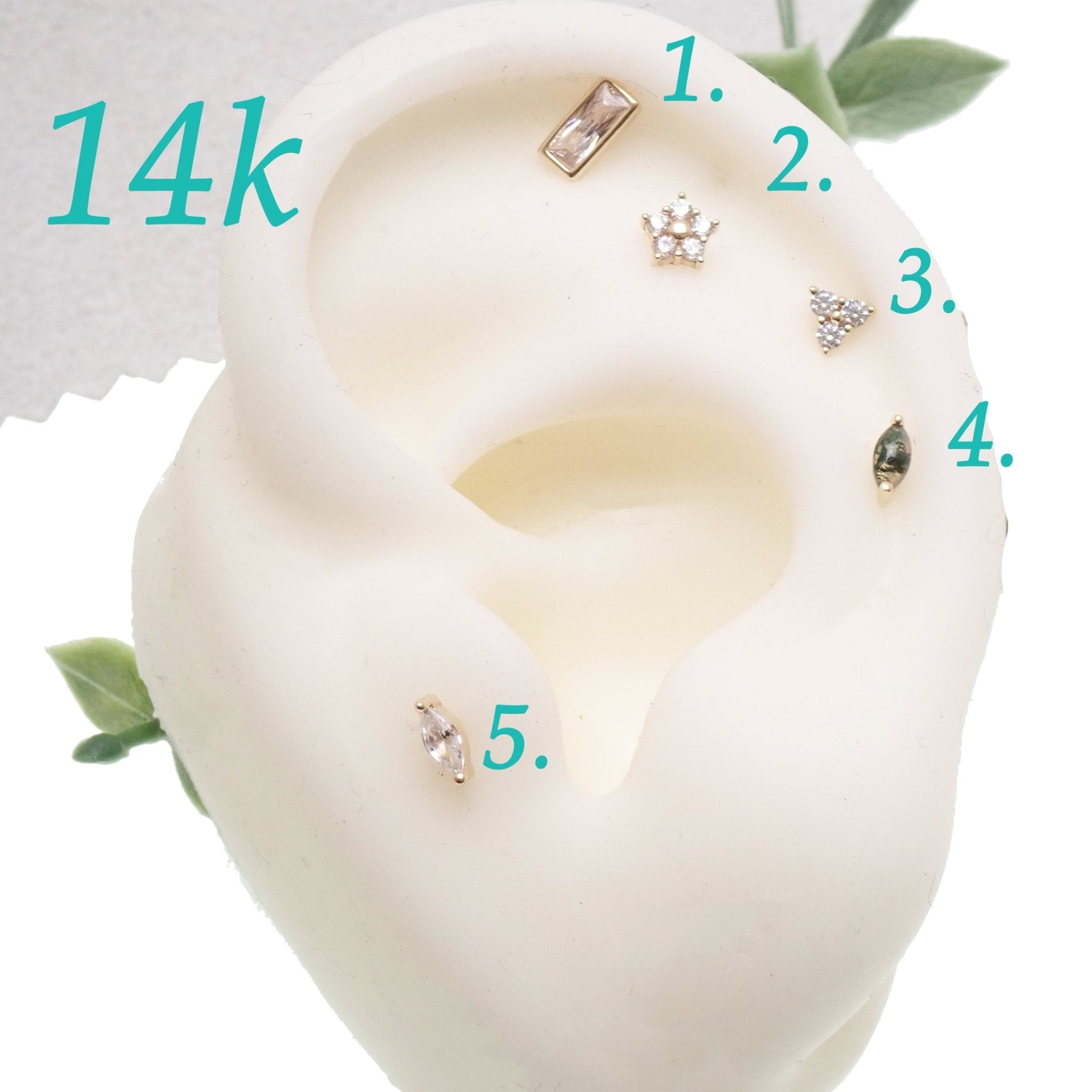 14k gold flower titanium flatback push fit piercing with decorative tops, designed for comfortable body jewelry wear.