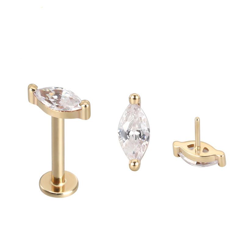 14k gold oval and titanium flatback push-fit piercing by Body Clickers, showing the sleek, threadless design for comfortable wear.