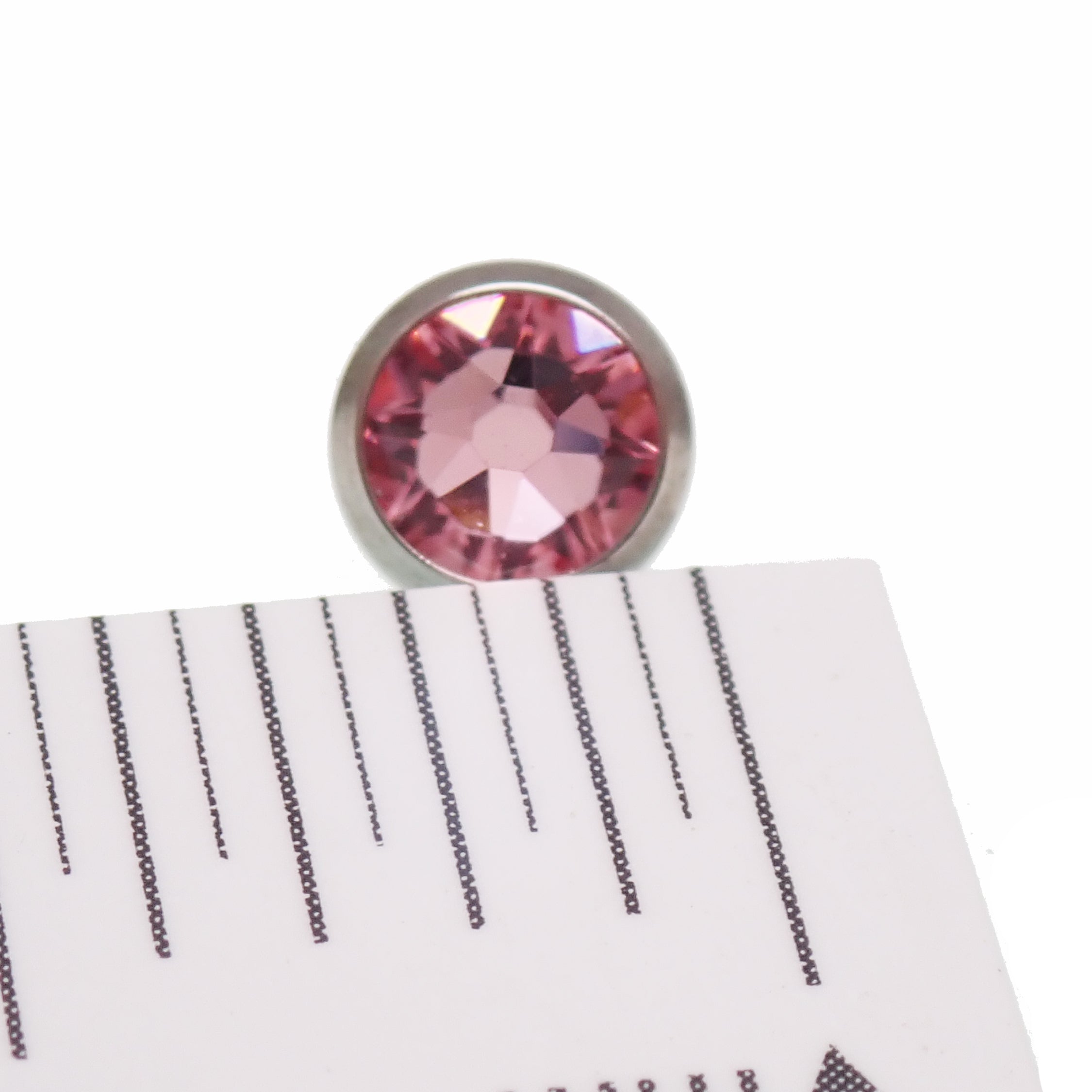 Green or pink CZ tongue barbell piercing in titanium, 14g, by Body Clickers with colorful cubic zirconia accents.