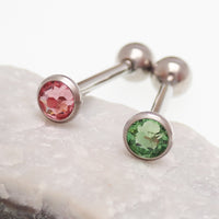 Pink or green CZ titanium tongue barbell piercing in 14g with a sleek barbell design by Body Clickers.