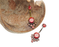 Colorful AAAA CZ belly piercing ring by Body Clickers, blue titanium belly ring with red CZ, internally threaded and hypoallergenic.