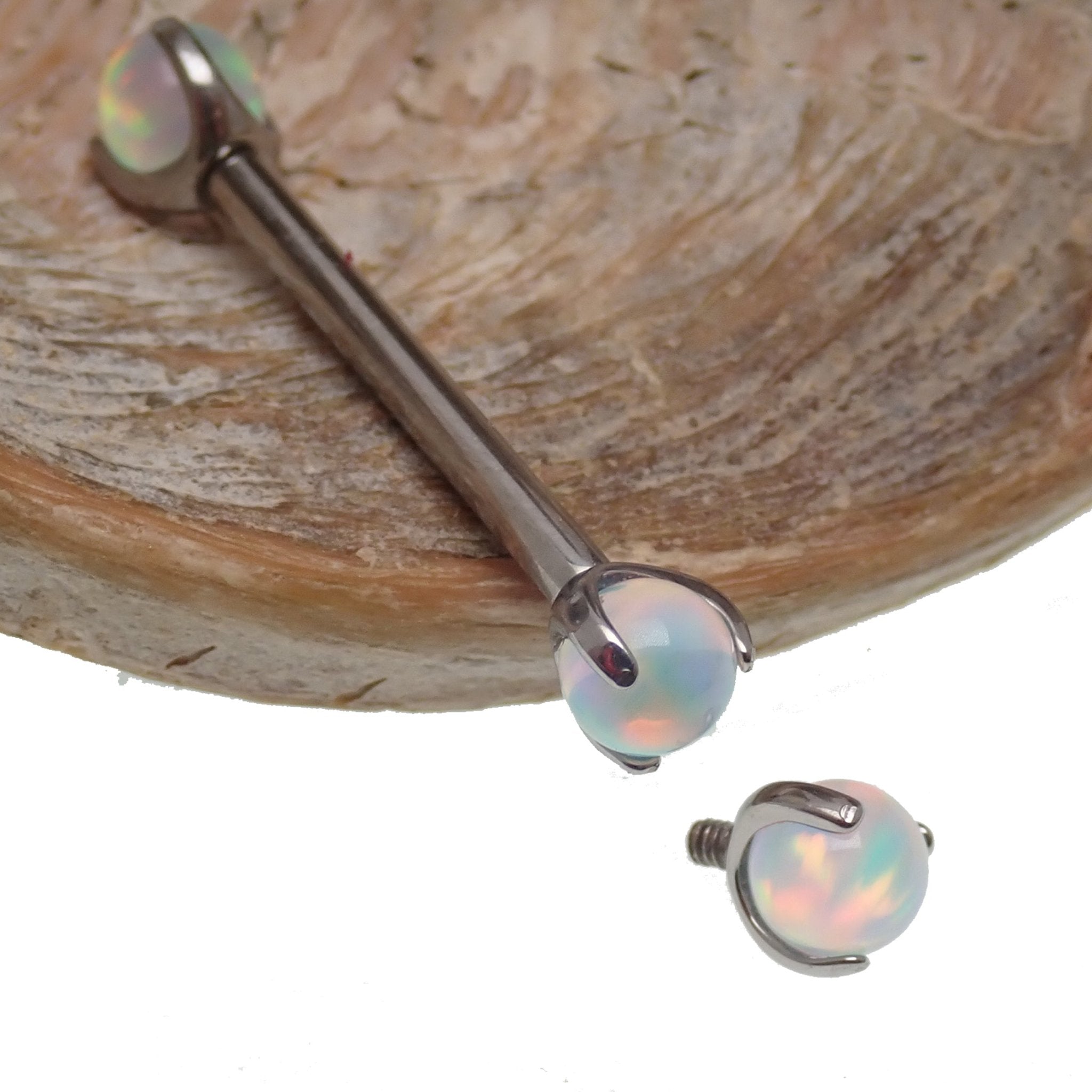 Pearly opal nipple jewelry by Body Clickers in 12g or 14g with 12mm diameter, featuring a polished opal design.