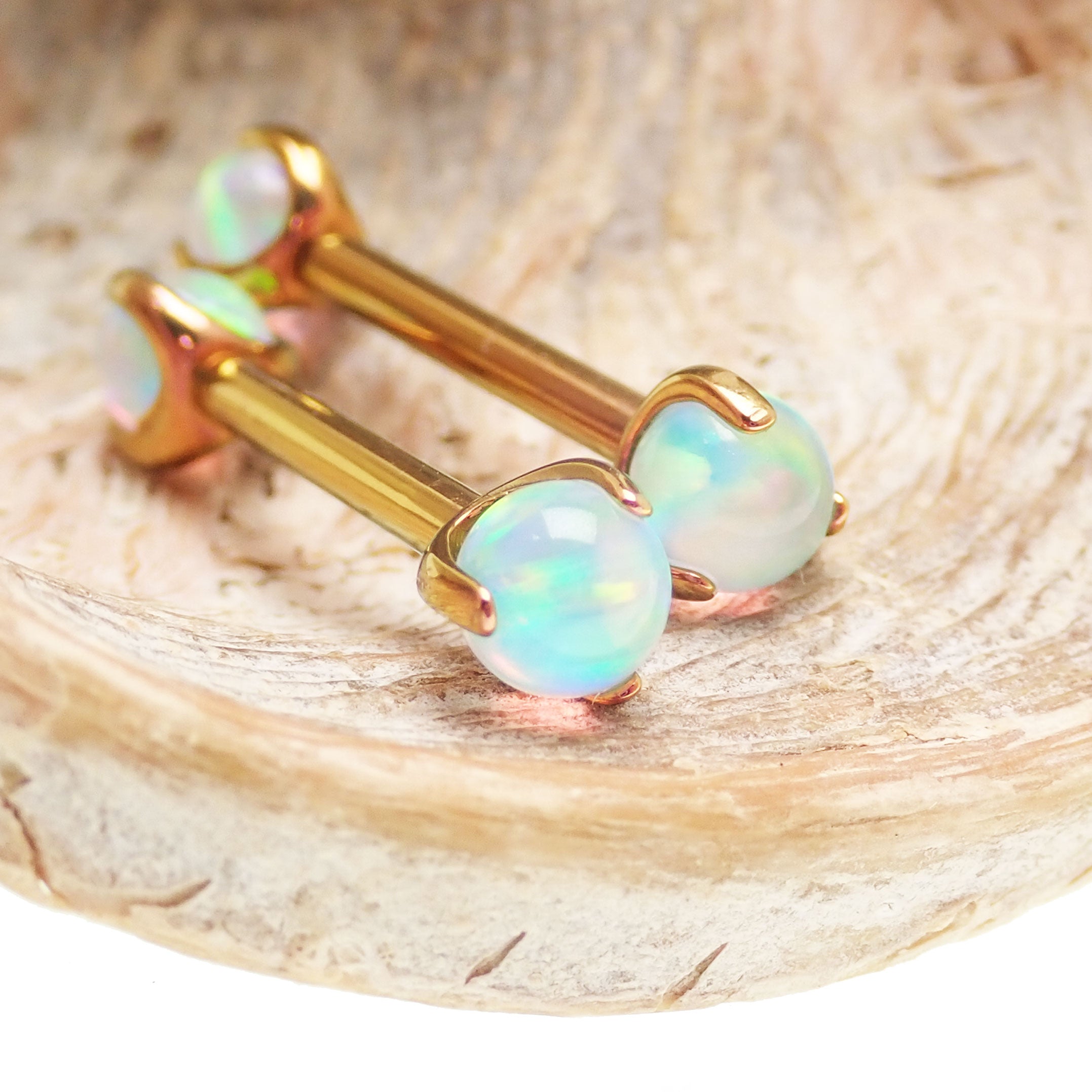 Pearly opal nipple jewelry by Body Clickers in 12g and 14g with 12mm diameter, featuring a shiny pearl-like design.