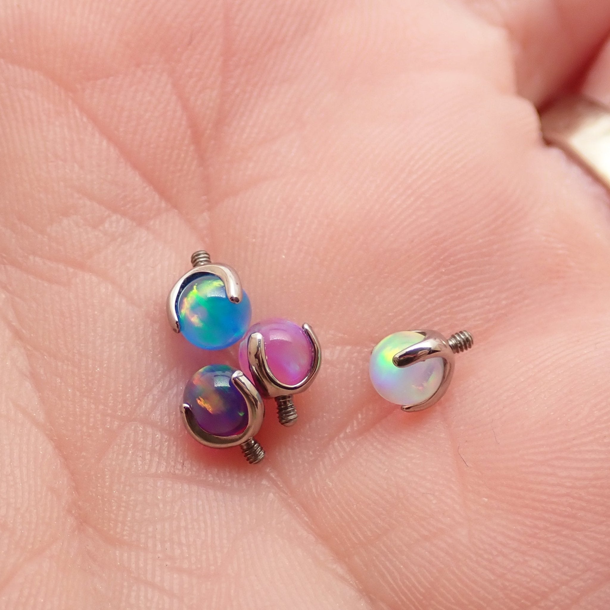 Pink jelly opal nipple jewelry by Body Clickers Body Jewelry, 12g gauge and 12mm size, with a smooth, rounded design.