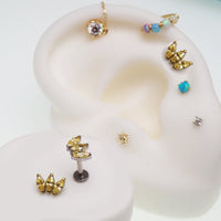 Citrine yellow CZ flatback body jewelry piercing by Body Clickers, available in 14g, 16g, and 18g sizes.