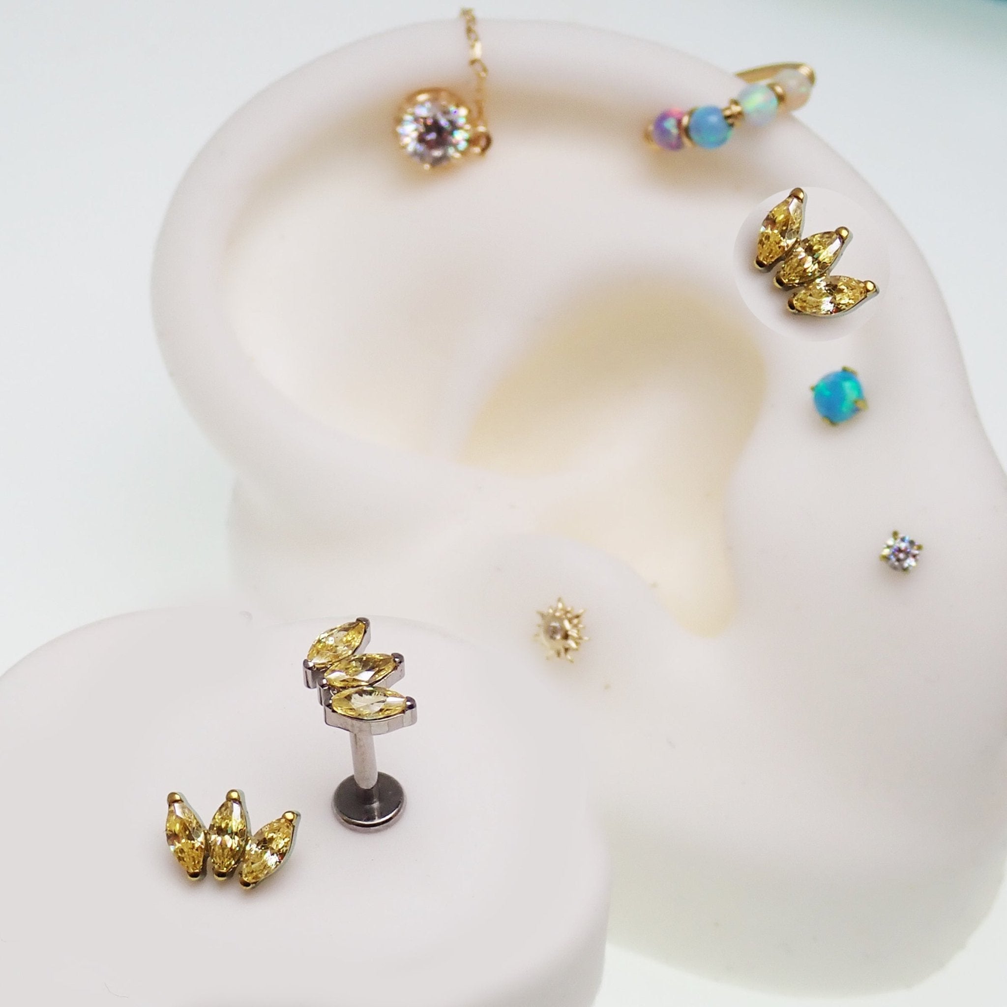 Citrine yellow CZ flatback body jewelry piercing by Body Clickers, available in 14g, 16g, and 18g sizes.