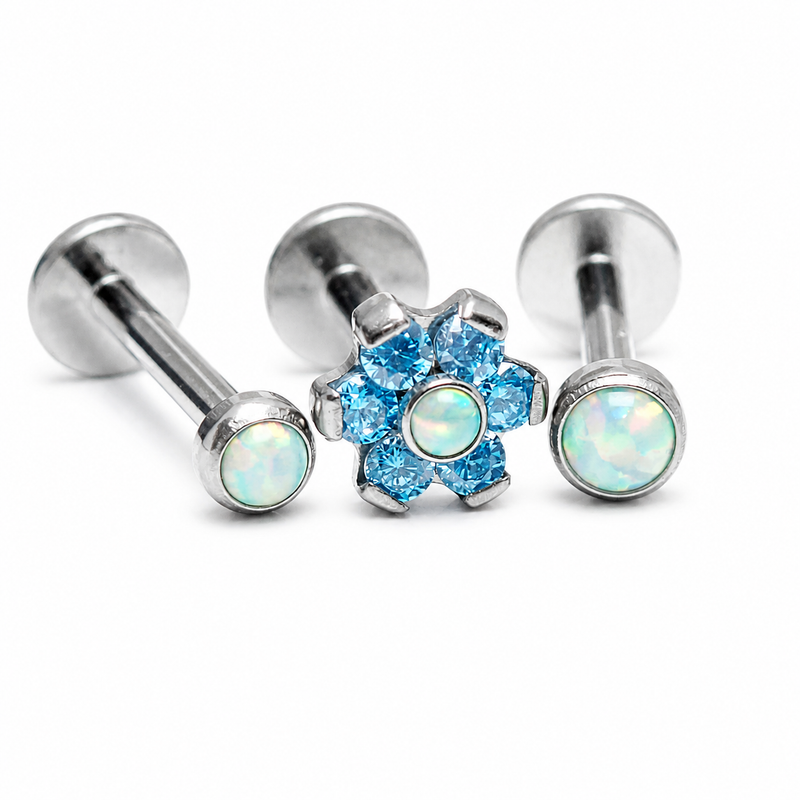 Body Clickers aqua and moon yellow opal triple helix body jewelry set with 18g, 16g, and 14g piercings shown in the image.
