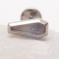 Titanium cross on coffin push fit body jewelry in 14g, 16g, 18g, and 20g sizes, featuring flatback design by Body Clickers.