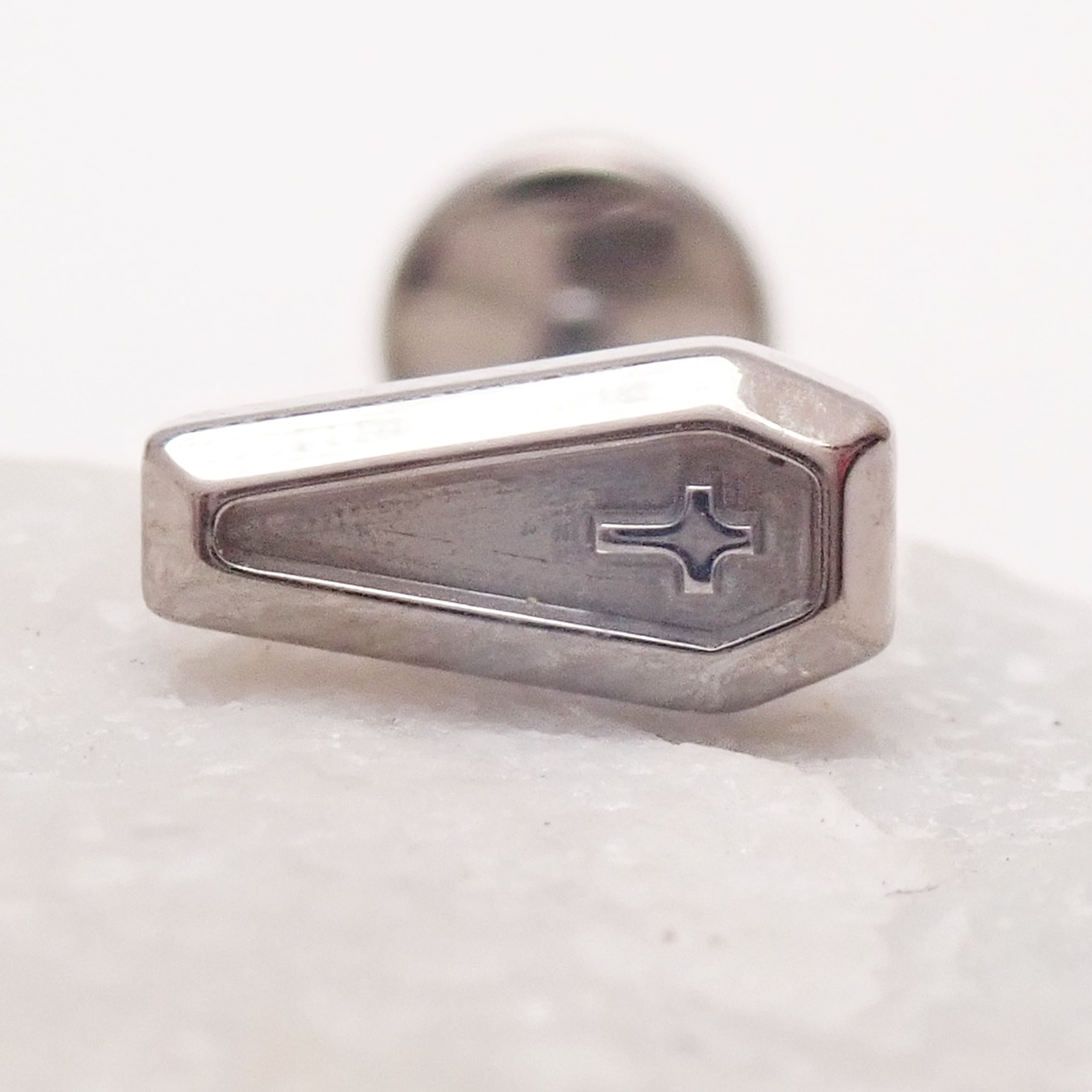 Titanium cross on coffin push fit body jewelry in 14g, 16g, 18g, and 20g sizes, featuring flatback design by Body Clickers.