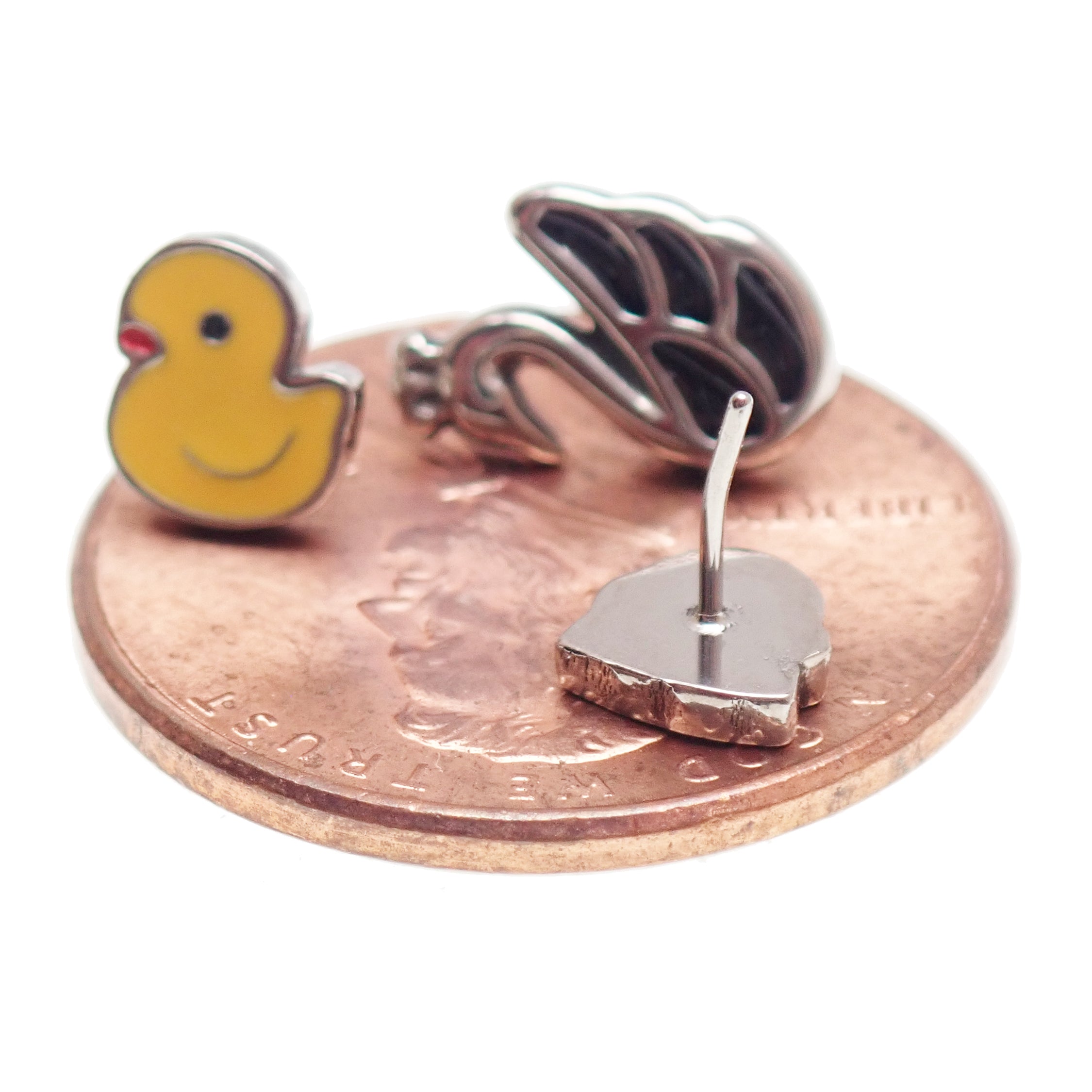 Titanium flat back push fit jewelry by Body Clickers in 14g to 20g, featuring duck and swan designs for implant-grade body piercing.