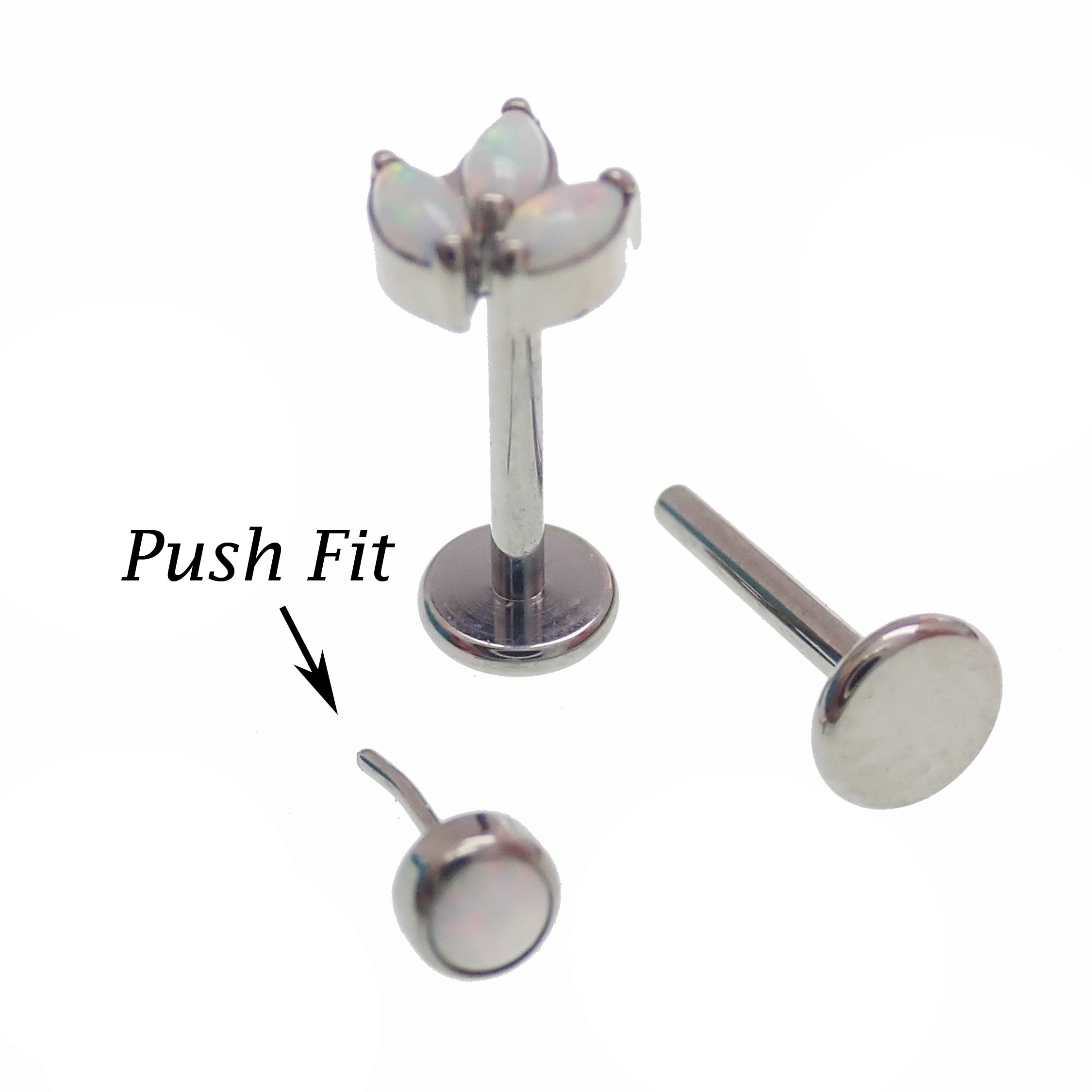 Set of four Body Clickers titanium implant flatback earrings with opal peacock blue push-fit design in 14g to 20g gauges.
