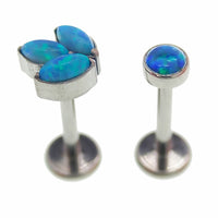 Body Clickers titanium implant flatback jewelry with peacock blue opal, available in 14g to 20g sizes, sold together.