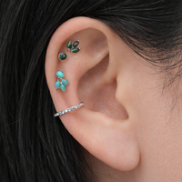 Body Clickers implant titanium opal push fit flatbacks in peacock blue, available in 14g to 20g, shown in a set of four.