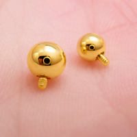 Internally threaded titanium PVD gold ball attachments for body jewelry, available in 14g and 16g gauges.