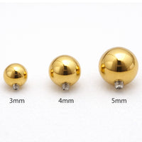 Internally threaded titanium PVD gold ball attachments for body jewelry in 14g and 16g sizes, by Body Clickers.