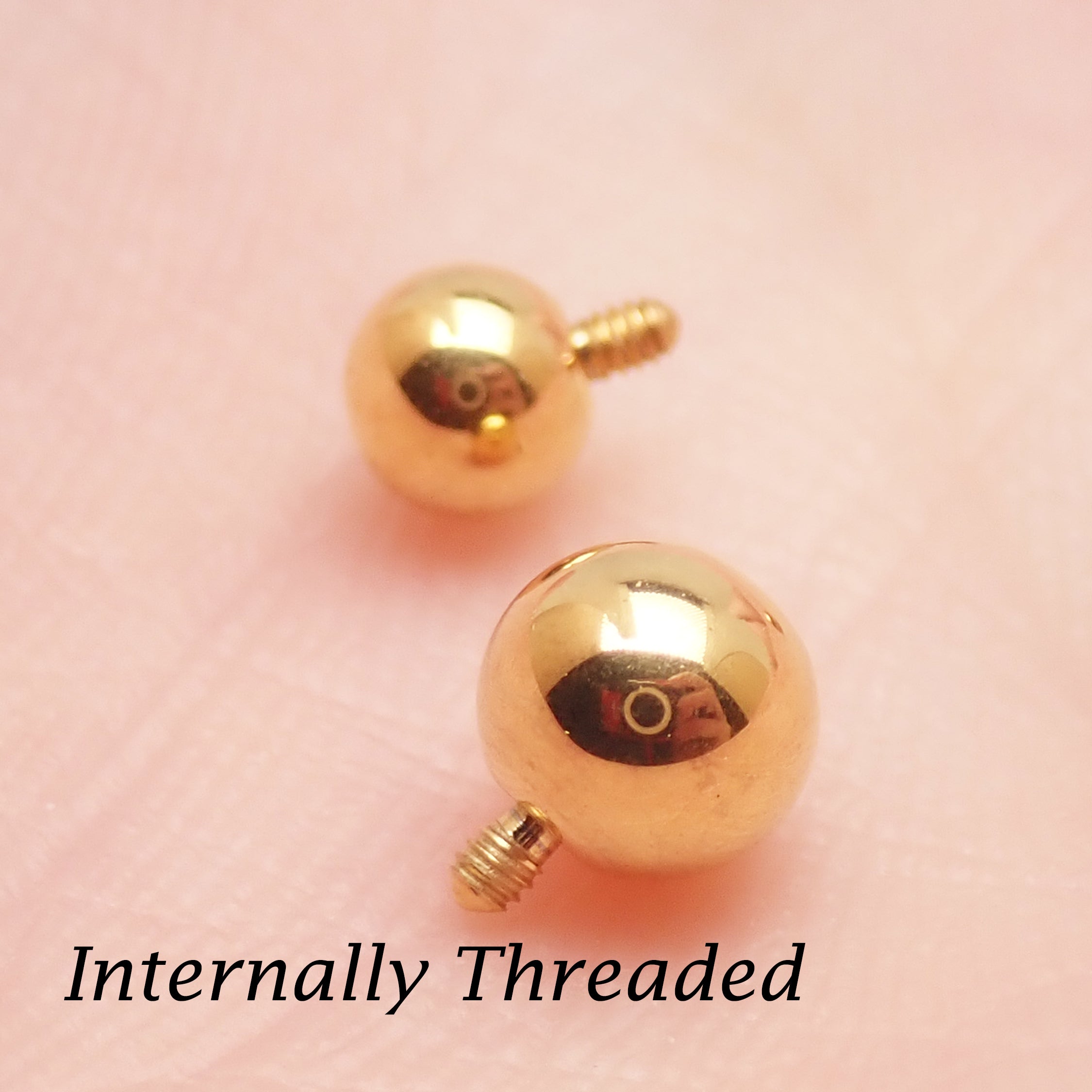 Internally threaded titanium PVD gold ball attachments for body jewelry in 14g and 16g gauges, by Body Clickers.