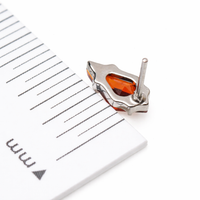 Implant grade titanium push-fit threadless piercing with a 5mm garnet stone flatback body jewelry by Body Clickers.