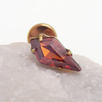 Titanium push-fit threadless piercing with a single garnet stone, flatback design, by Body Clickers Body Jewelry.