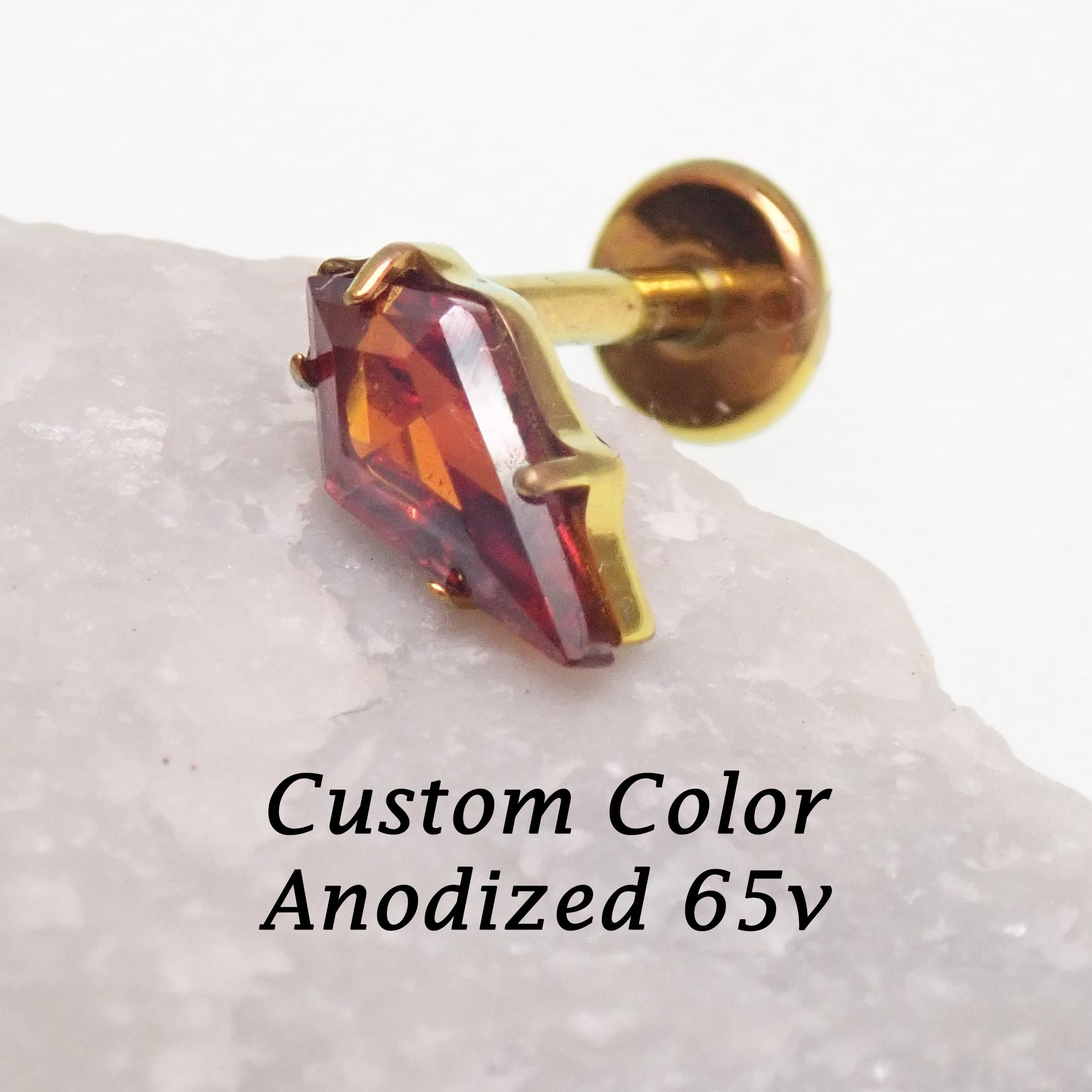 Implant grade titanium push-fit threadless piercing with a 5mm garnet stone flatback from Body Clickers Body Jewelry.