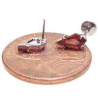Implant grade titanium push-fit threadless piercing with a single garnet stone flatback, body jewelry by Body Clickers.