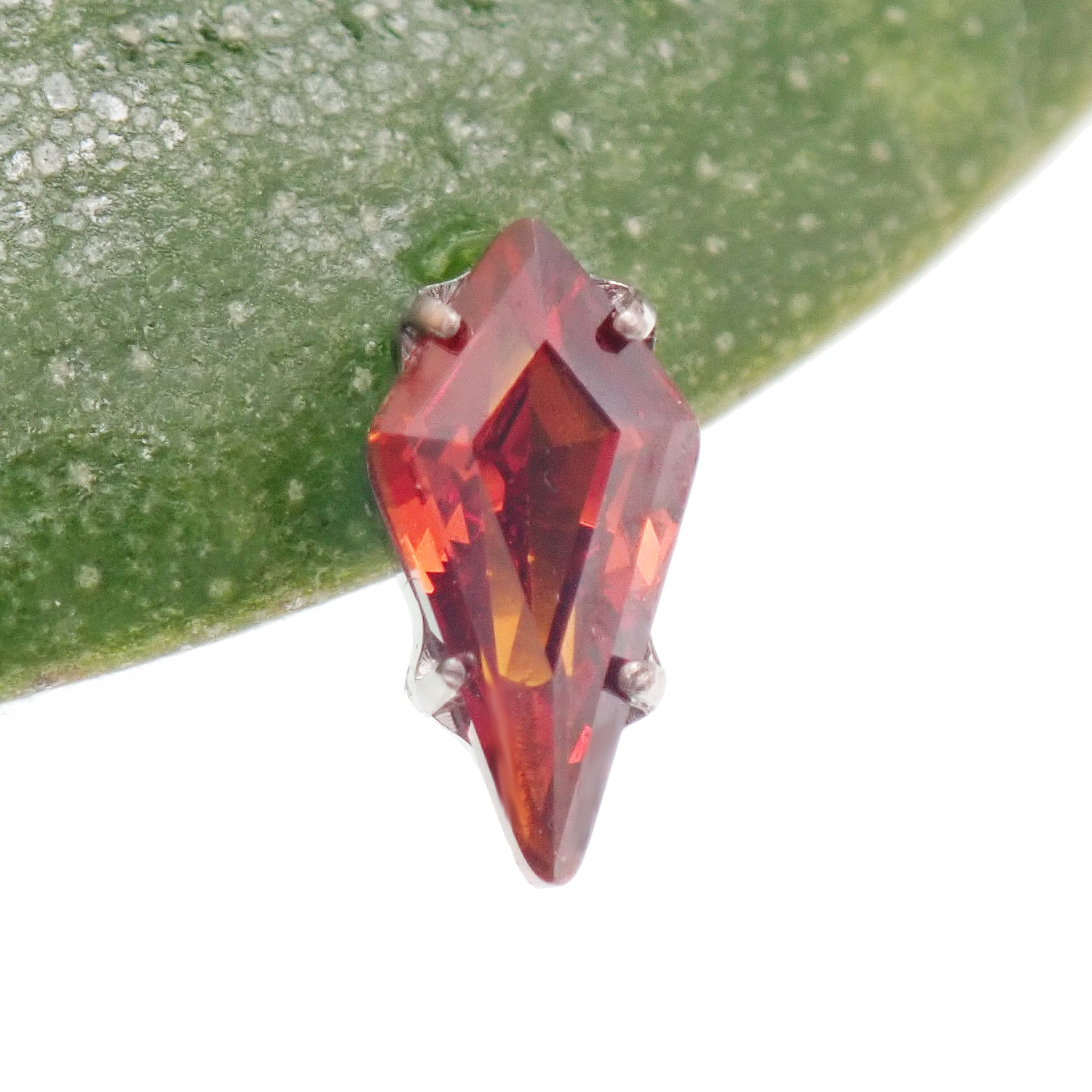 Titanium push-fit threadless piercing with a 5mm garnet stone and flatback design by Body Clickers Body Jewelry.