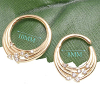 14k gold cosmic septum and daith clicker jewelry in 16 gauge with celestial star design and secure click closure.
