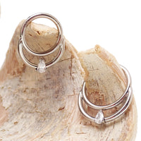 16g Body Clickers double clicker body jewelry with 8mm and 10mm double-clicker design, featuring sleek silver finish.