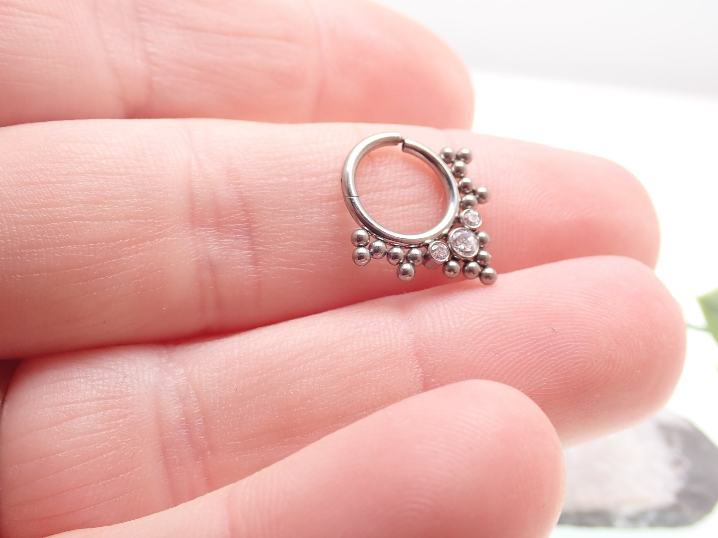 Beaded and CZ hinged titanium clicker body jewelry in 16g with 8mm beads, featuring sparkling cubic zirconia accents.