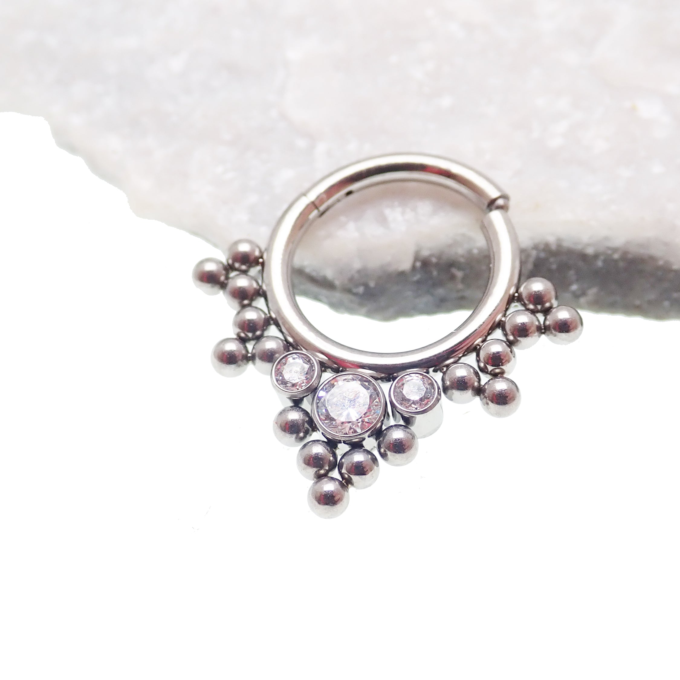 Beaded and CZ hinged titanium clicker body jewelry in 16g with 8mm beads and sparkling cubic zirconia accents.