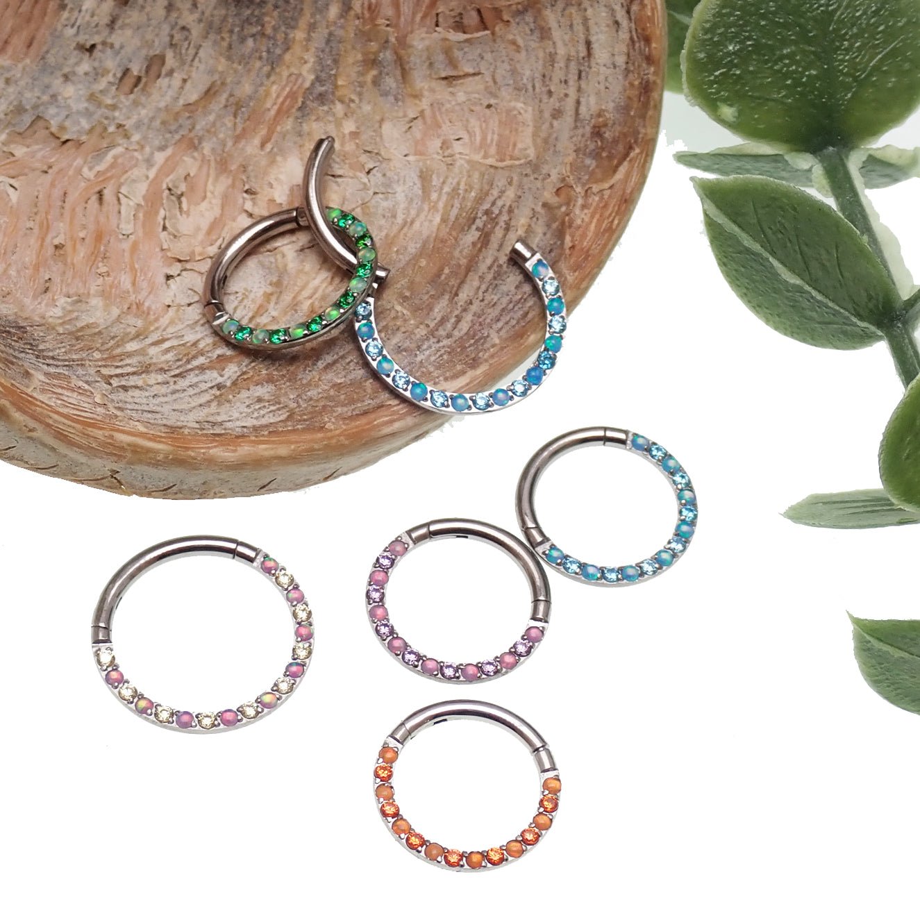 Green opal and CZ front titanium clicker body jewelry in 16g with 8mm diameter, from Body Clickers.