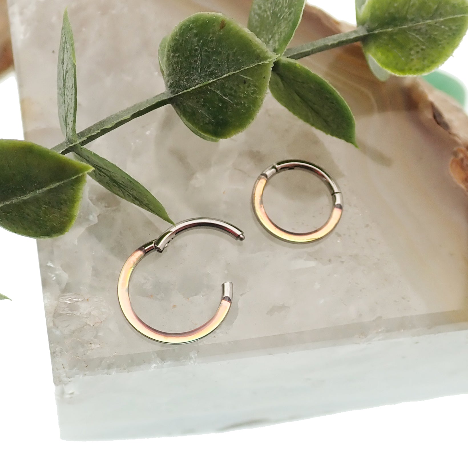 Photochromic epoxy clicker ring from Body Clickers Body Jewelry, 16g, 8mm, featuring color-changing effects.