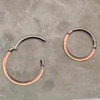 Photochromic epoxy clicker ring 16g by Body Clickers Body Jewelry, featuring an 8mm adjustable body jewelry design.
