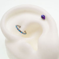 Titanium teardrop flatback dermal piercing attachment in peacock blue, 14g, 6mm size with 1.2mm threaded body jewelry.