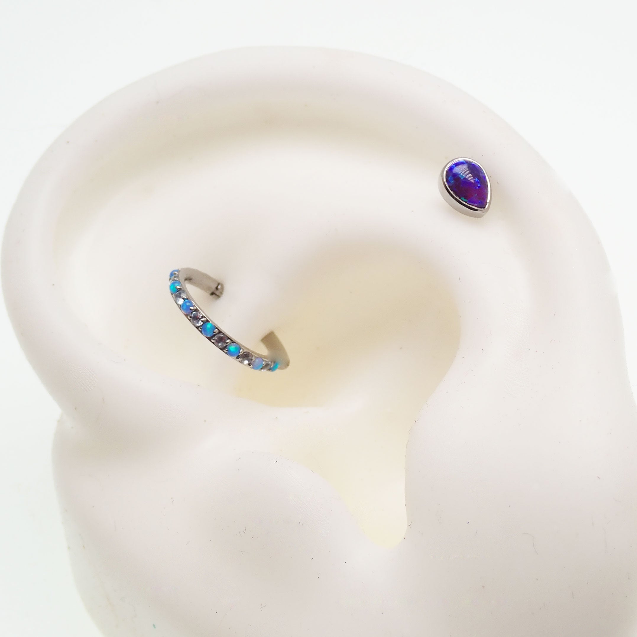 Titanium teardrop flatback dermal piercing attachment in peacock blue, 14g, 6mm size with 1.2mm threaded body jewelry.