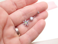 Titanium 14g dangly drop belly ring by Body Clickers with a sleek implant design and decorative hanging element.