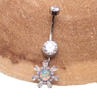 Titanium 14g dangly drop belly ring by Body Clickers Body Jewelry featuring a sleek implant design and dangling charm.