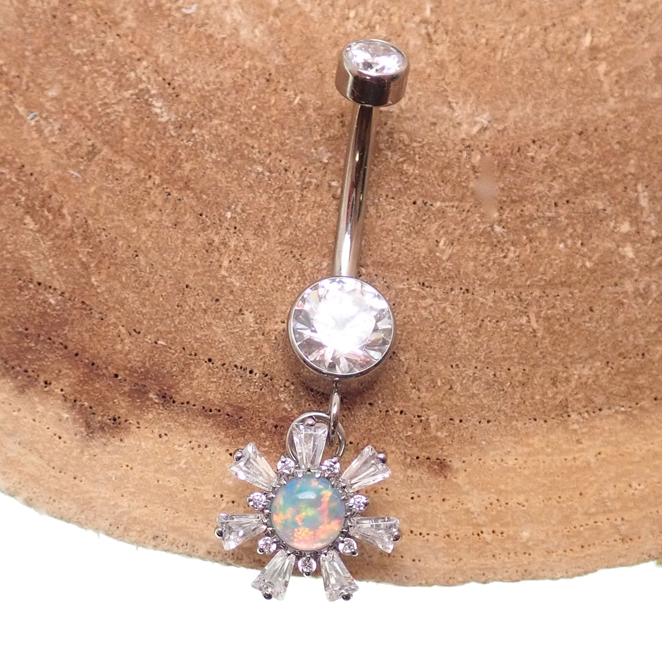 Titanium 14g dangly drop belly ring by Body Clickers Body Jewelry featuring a sleek implant design and dangling charm.