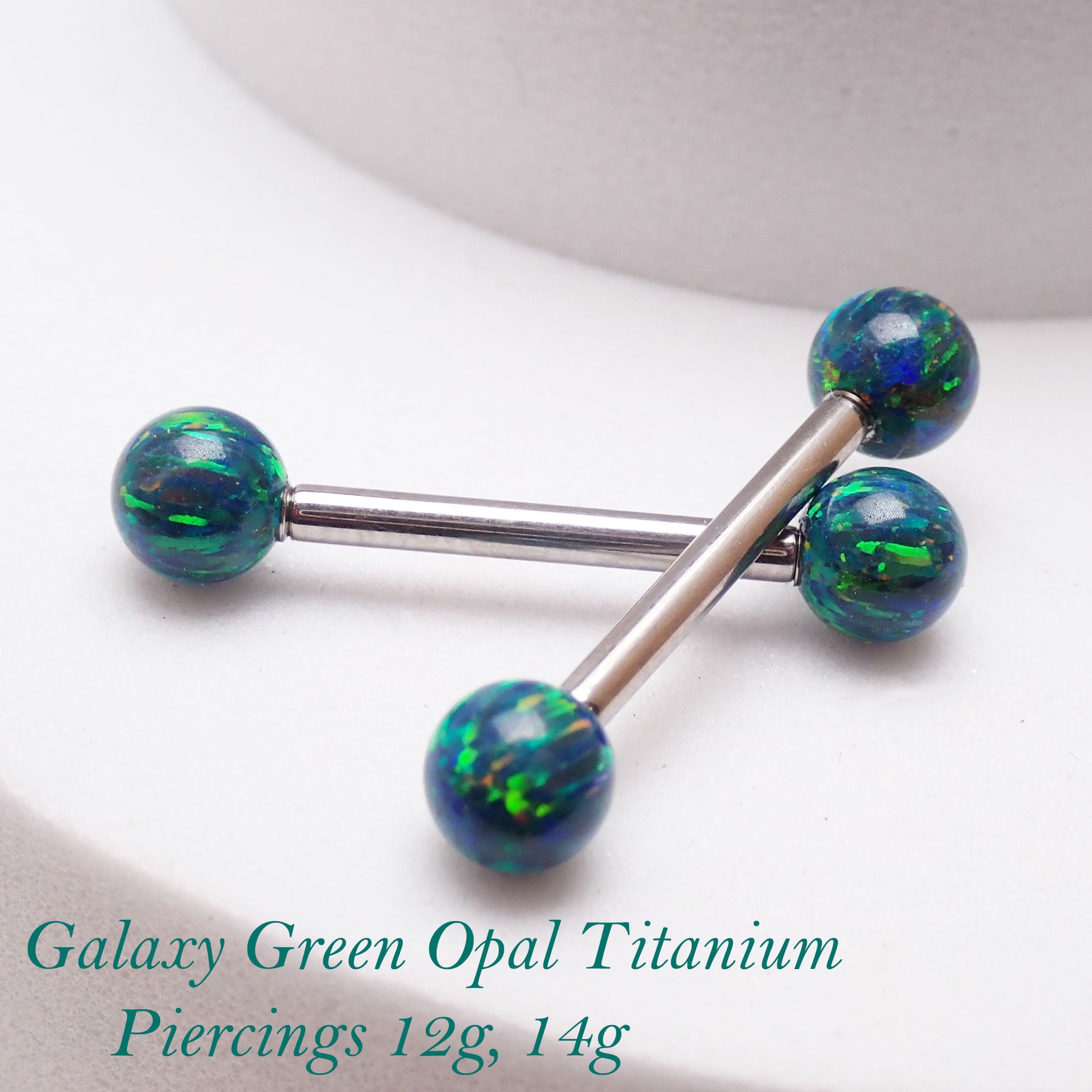 Galaxy green fire opal titanium nipple ring in 14g and 12g, body jewelry with a smooth, rounded gemstone ball design.